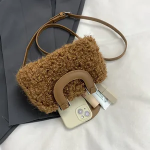 Stylish brown faux fur square handbag with adjustable shoulder strap and leather handle