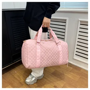Detailed view of the stylish pink quilted sports duffel bag for fitness and short travel