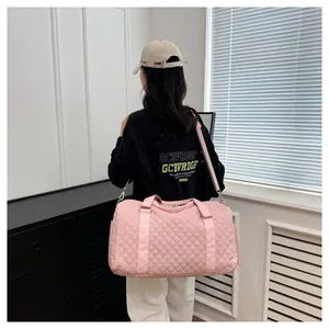 Fashionable pink quilted gym bag for women, perfect for weekend overnight travel