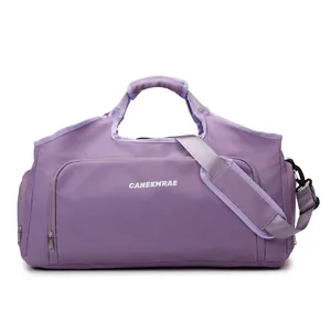 Detailed view of a purple high-capacity sports and travel duffel bag with strap