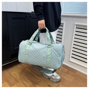 Detailed view of large quilted mint green sports duffel bag for gym and short travel