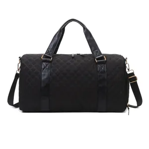 Black quilted duffle bag with gold hardware for gym or short travel business trips.