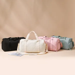 Professional quilted gym and travel duffel bags available in multiple pastel colors