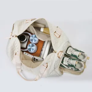 Cream quilted travel duffel bag for fitness and business with separate shoe compartment
