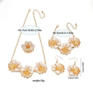 Detailed view of white enamel floral jewelry set showing exact product dimensions