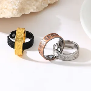 Detailed view of vintage magnetic rings with Tree of Life engraving in multiple colors.