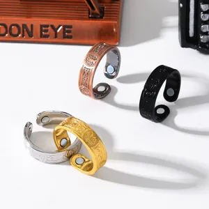 Detailed close-up of vintage magnetic rings featuring Tree of Life and Celtic knot motifs.
