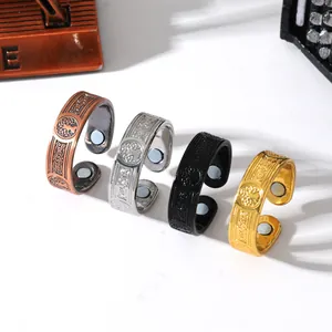 Macro detail view of four vintage magnetic therapy rings featuring Tree of Life patterns