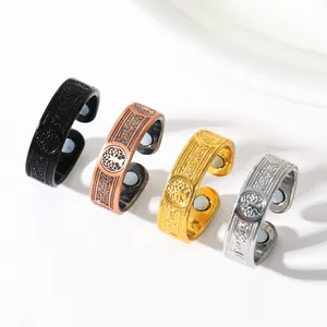 Set of four retro magnetic rings with tree of life pattern in various metallic finishes