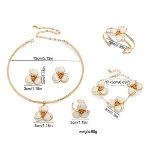 Detailed view of white enamel flower jewelry set with necklace, bracelet, and earrings dimensions