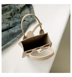 Top view detail showing the interior of a minimalist beige tote bag with magnetic closure