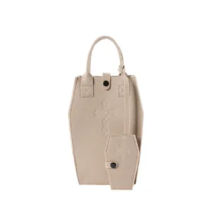 Gothic coffin shaped beige felt handbag with embossed cross detail and matching mini pouch