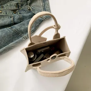 Minimalist cream handheld tote bag with large capacity for student commuting and daily use