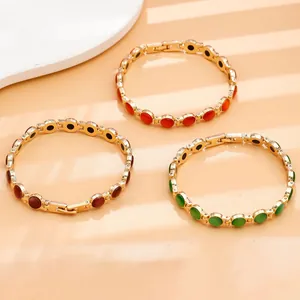 Braccialetti dorati di moda con vivaci pietre occhio di gatto in tre colori vivaci