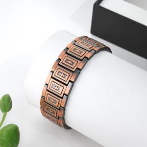 Detail of antique red copper magnetic bracelet with square shield textured links for men