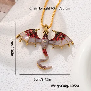Detailed macro view of vintage flying dragon pendant with red enamel and purple rhinestones
