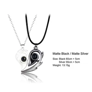 Close-up of magnetic heart-shaped couple projection necklaces with size details