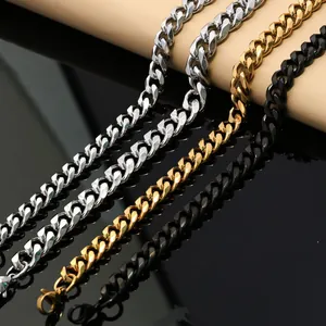 Detailed view of silver, gold, and black stainless steel Cuban link chains.