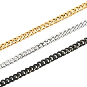 Close-up of hip hop style stainless steel Cuban link chains in gold, silver, and black