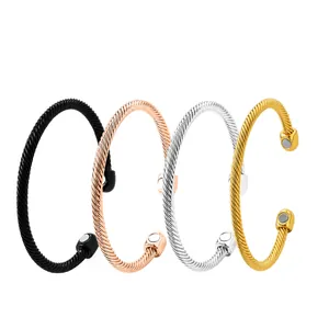 Detailed view of four twisted magnetic therapy cable bracelets in multiple colors