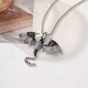 Detailed view of retro dragon pendant necklace with enamel wings and rhinestones