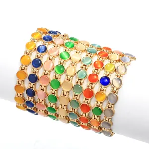 Eleganti bracciali da donna placcati in oro con vari inserti colorati in pietra occhio di gatto