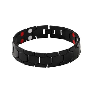 High-quality detail of black magnetic bracelet featuring red and white energy stones