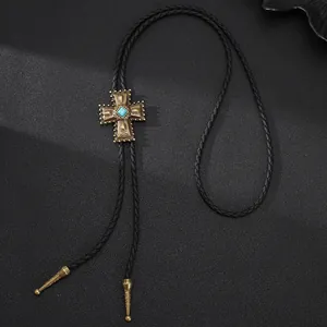 Vintage Western-Bolo-Tie mit Türkis-Kreuzanhänger und schwarzer geflochtener Kordel.