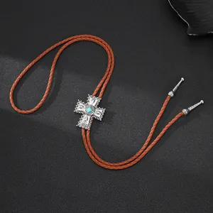 Vintage Western Cowboy Bolo Tie mit silbernem Kreuzanhänger und Türkiseinlage.
