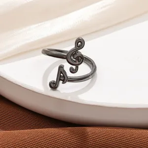 Detailed view of an adjustable gunmetal black musical note ring gift for music lovers