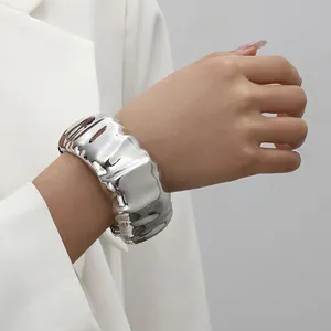 Detailed macro view showing the textured pleated design of this silver wide cuff bracelet