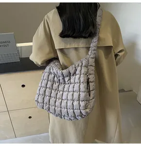Large grey quilted puffer shoulder bag with high capacity for casual commuting