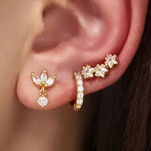 Elegant gold-plated hoop and stud earring set featuring sparkling cubic zirconia stones