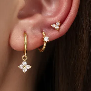 Elegant gold-plated copper hoop and stud earring set featuring sparkling cubic zirconia stones