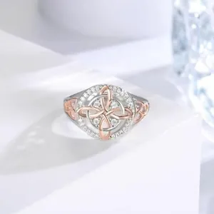 Elegant two-tone zircon ring featuring a rose gold Celtic knot design for women.