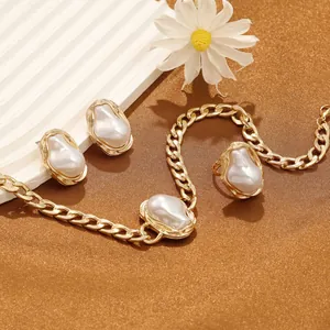 Exquisite detail of luxury baroque pearl jewelry set featuring gold necklace and earrings