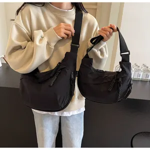 Comparison of two sizes of black canvas dumpling bags for daily casual commuting style