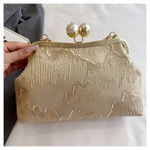Elegant New Chinese style clutch with intricate sequins and a pearl clasp detail