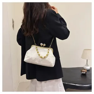 Elegant Neo-Chinese white fabric clutch bag with pearl bead handle and chain strap.