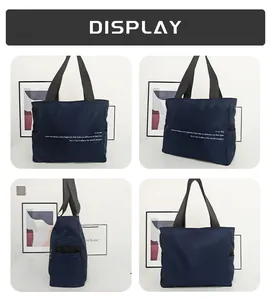 Vistas detalladas de un bolso de hombro de nailon azul oscuro con diseño sencillo