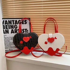 Trendy heart-shaped handbags with crocodile pattern for women in chic black and white colors
