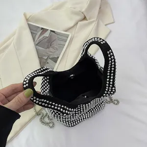 Modern women's rhinestone bucket bag with silver chain strap for elegant commute fashion