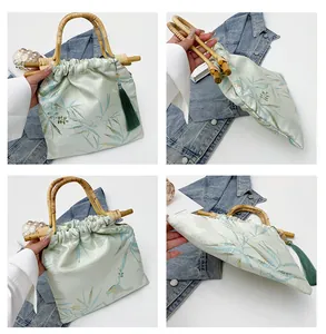 Borsa a mano in stile neo-cinese con manici in bambù e stampa di foglie elegante