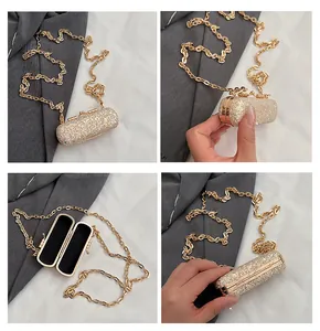 Detailed views showing the glitter texture and gold chain of this mini lipstick bag