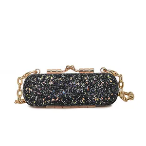Elegant black sequin mini lipstick bag with a stylish gold chain strap for evening parties