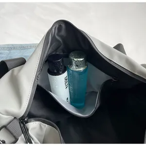 Interior pocket detail of the large capacity travel bag showing storage space