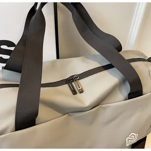 Close-up of a grey large capacity travel bag with durable double zipper