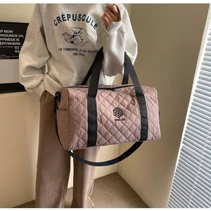 Stylish pink quilted travel bag carried by a model in a modern lifestyle setting