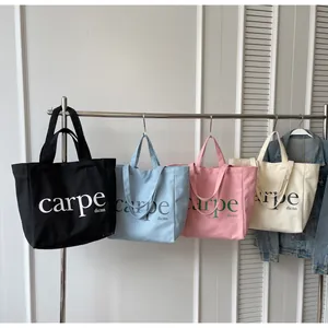 Detail view of large capacity carpe dienn canvas tote bags in four stylish colors