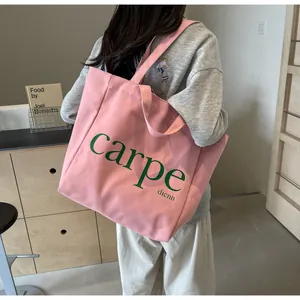 Stylish large capacity pink canvas tote bag with carpe text print for women's daily use